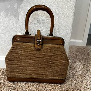 Leather / woven / brass purse. Interior and handle are leather. Vintage.